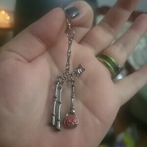 Cute skeleton girl trick-or-treating halloween earrings, movable limbs